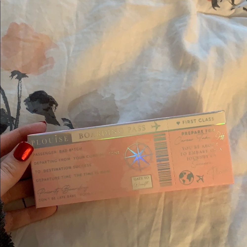 P Louise First class boarding pass
